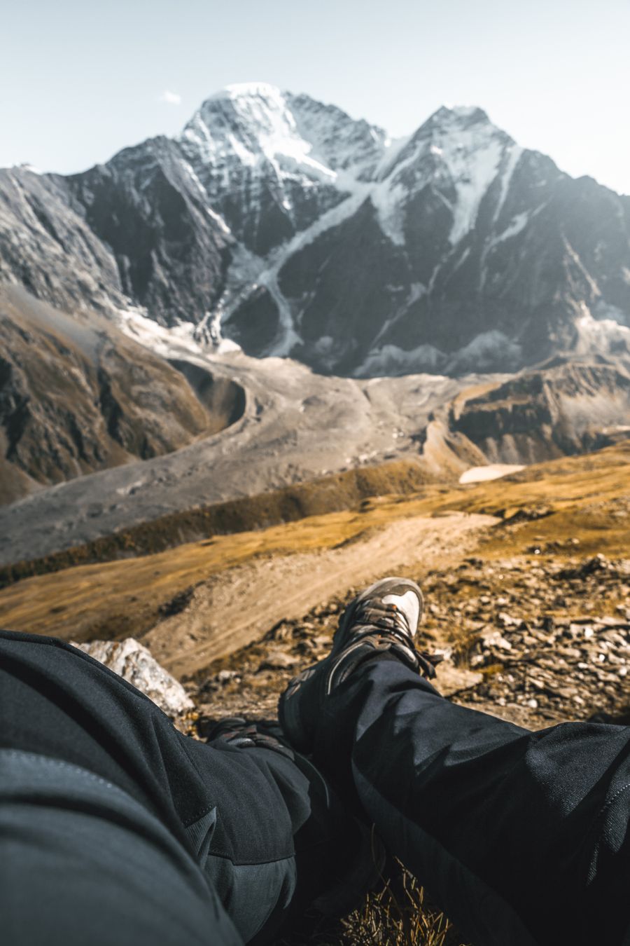 person sitting on a mountain
