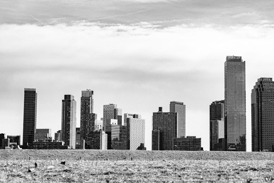 grayscale photograph of high rise buildings in new york