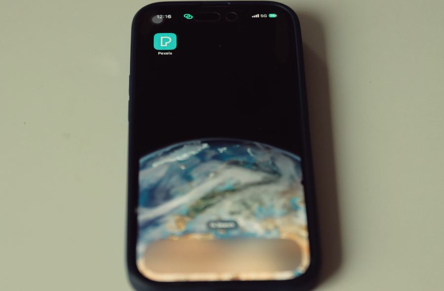 smartphone with earth wallpaper