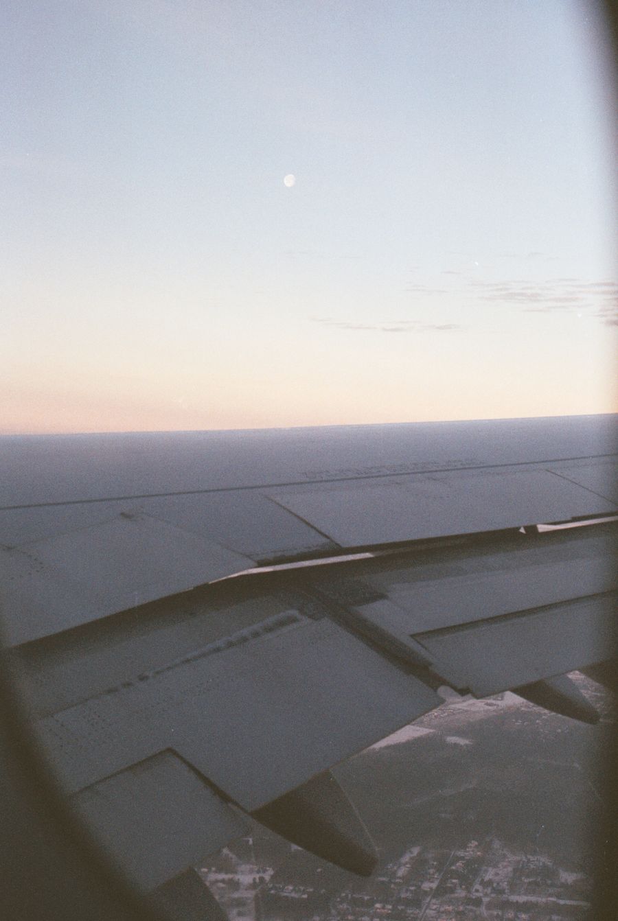 wing of a flying passenger airplane