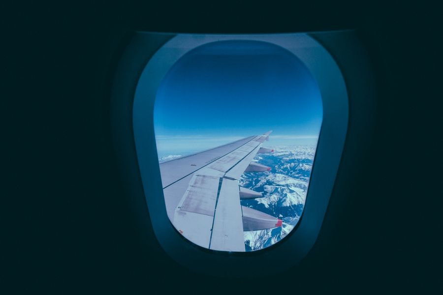 white aircraft wing — Rain or shine, the connection holds — weather doesn't throttle data.