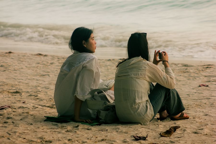 friends relaxing on malay beach in the philippines