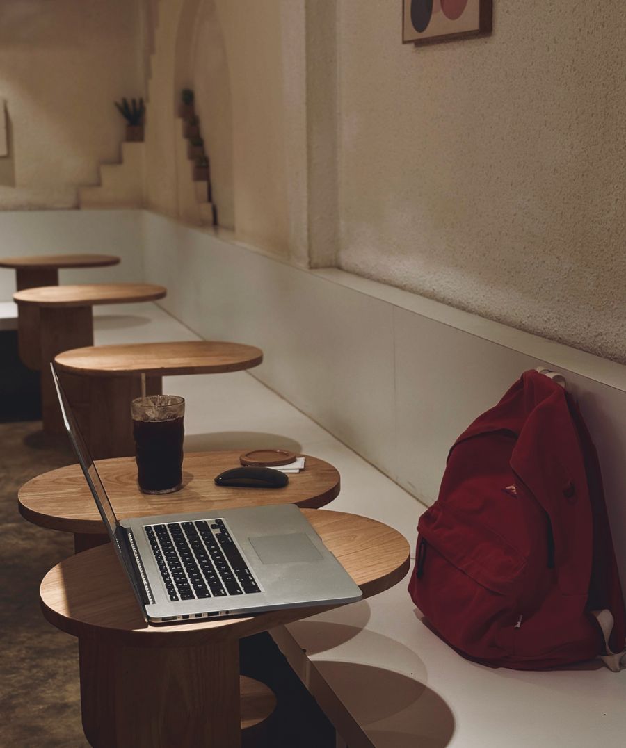 cozy cafe workspace with laptop and drink