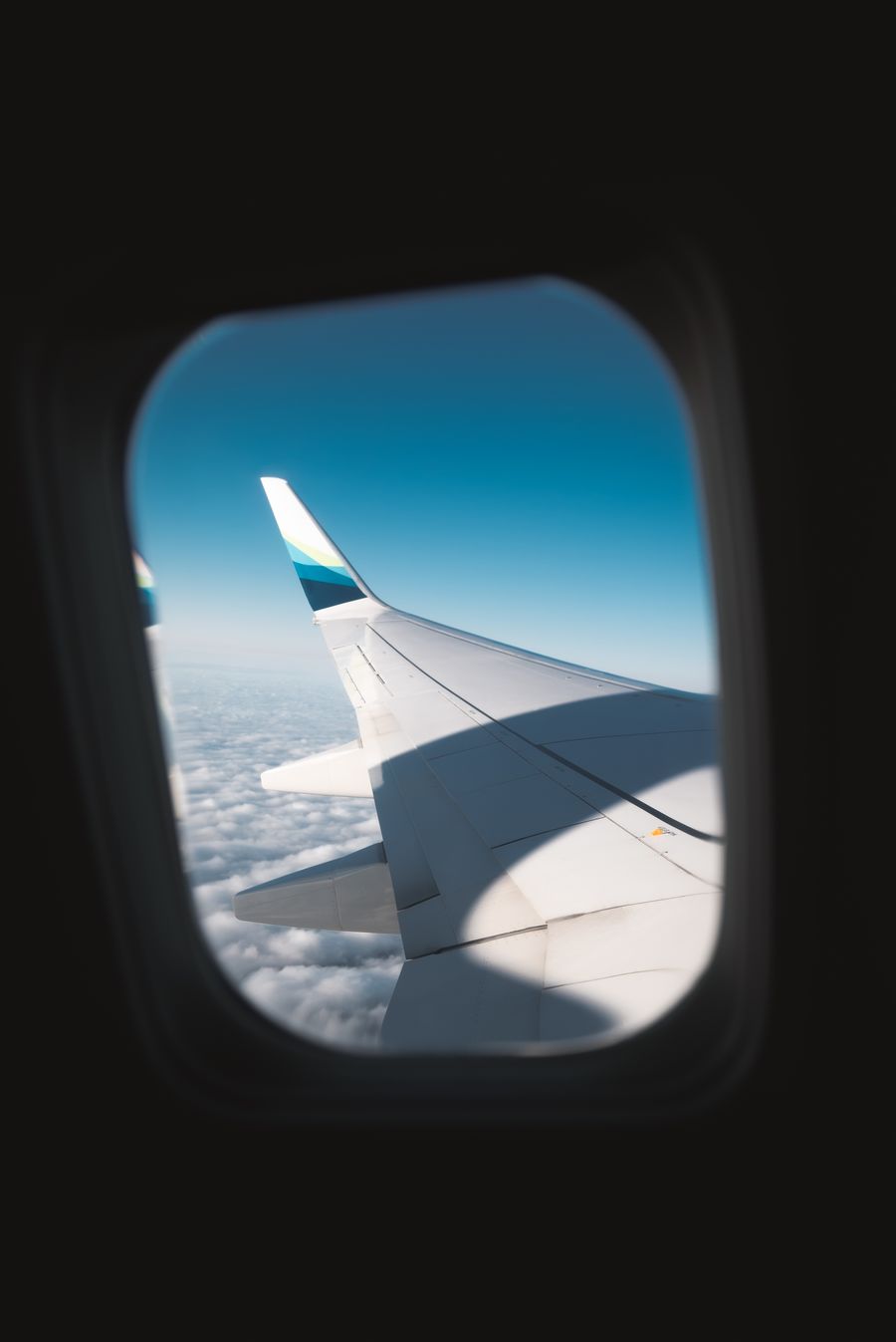 white airplane wing — Country Connectivity Fact Sheet: answers first, never a signup wall.
