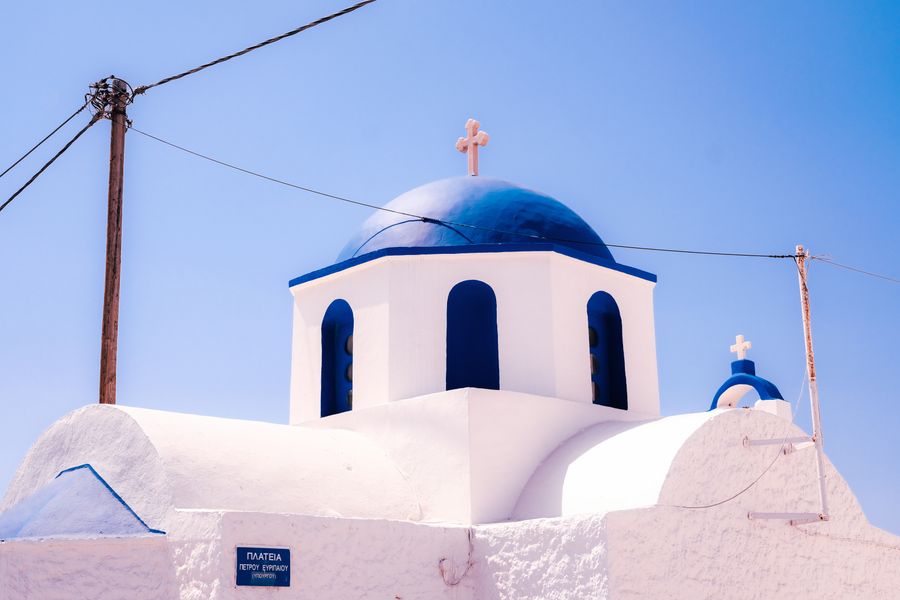 traditional blue dome church in santorini