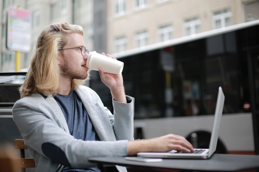 man drinking coffee while working on his laptop — Inputs are validated as you type — mistakes get caught before they become wrong answers.