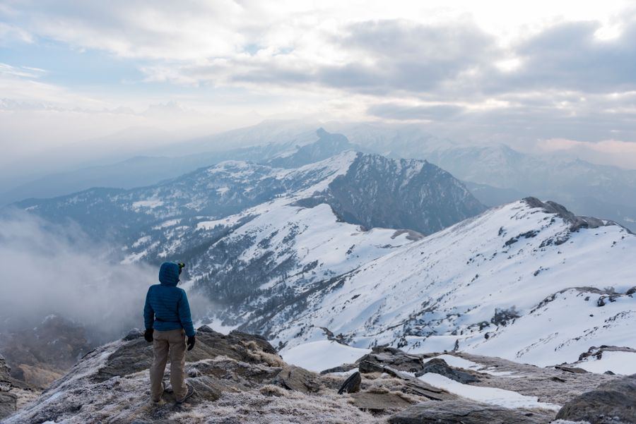 a man looking at mountains