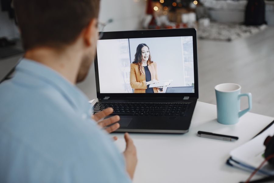 man conferring online with woman — Data Balance: answers first, never a signup wall.