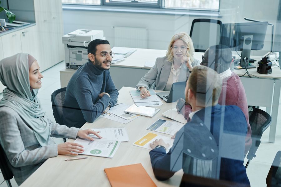 employees having a meeting inside the conference room — Free Wi-Fi Finder: the fastest way to turn a vague travel question into a next step.