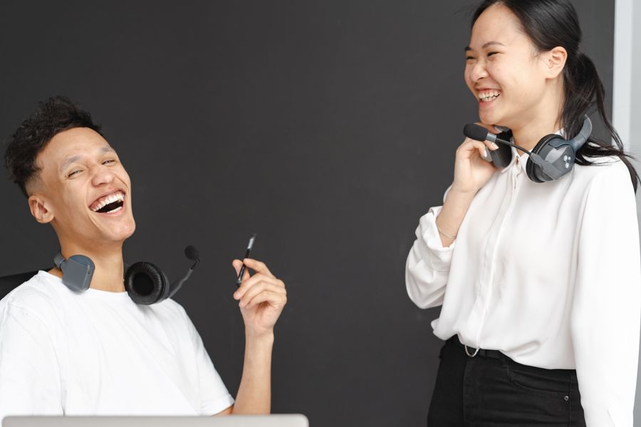 laughing man and woman working in a call center — The FAQ below Data-Saver Setup answers the six questions everyone asks first.